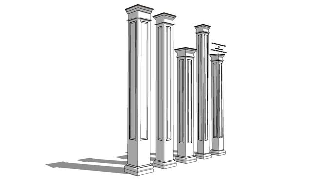 three tall white pillars standing next to each other