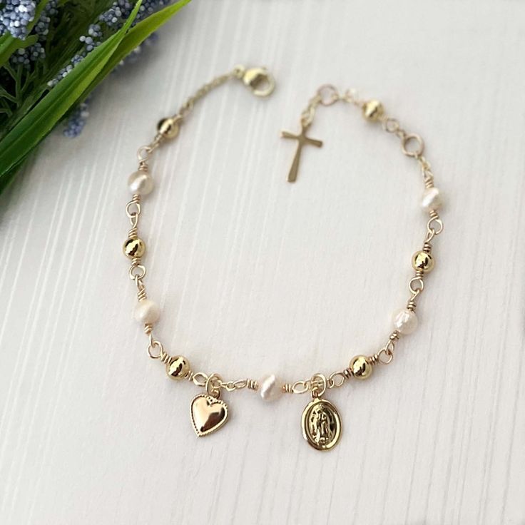 The Virgin Mary rosary bracelet is made with precision and expertise, our rosary bracelet features meticulously chosen genuine gemstones and 18k gold-plated and gold-filled components. Each bracelet is a unique work of art, handmade by our team using high-quality materials and carefully packaged in a gift box, ready to be presented to someone special. *  If you need a different size, please don't hesitate to contact me. I would be more than happy to assist you. *  Adjustable adult wrist - 6 1/2" Virgin Mary Rosary, Guadalupe Bracelet, Gold Rosary Necklace, Catholic Bracelet, Gold Rosary, Catholic Jewelry, Rosary Bracelet, The Virgin Mary, Unique Bracelets