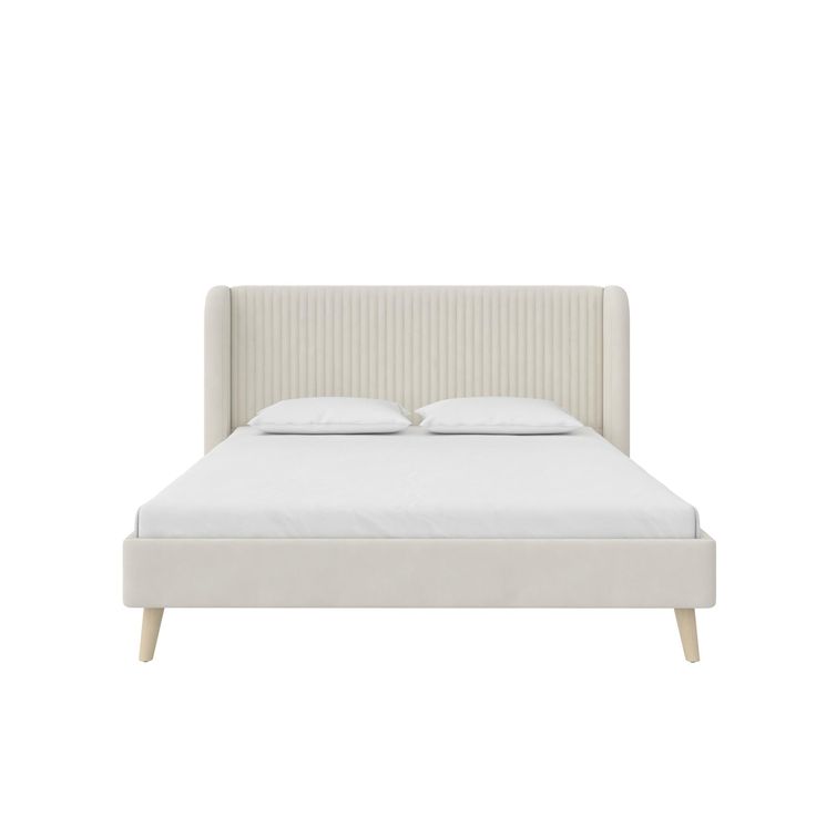 a white bed with two pillows on top of the headboard and one foot board