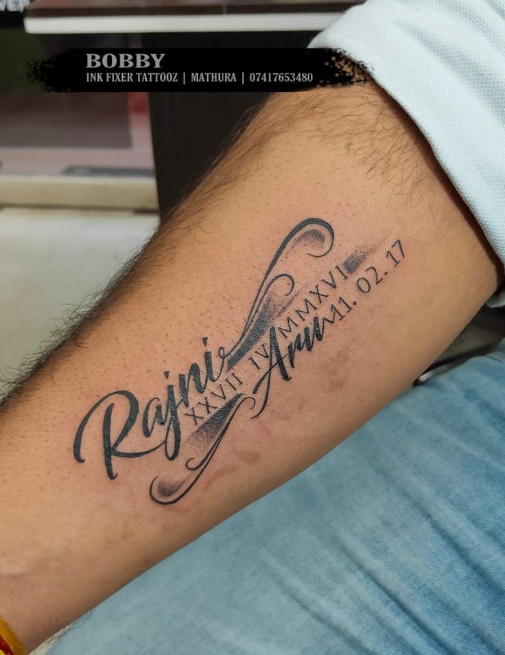 a man with a name tattoo on his arm