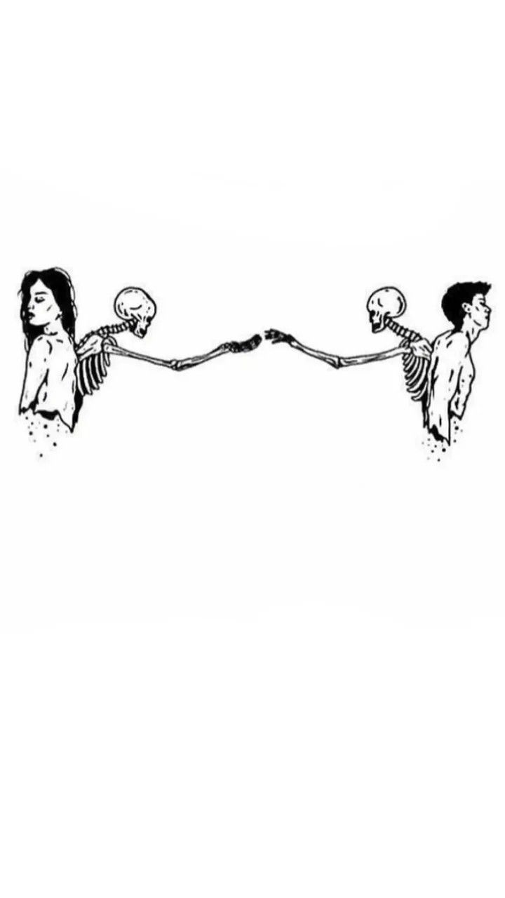 two people holding hands with skulls in the air and one person standing on top of them