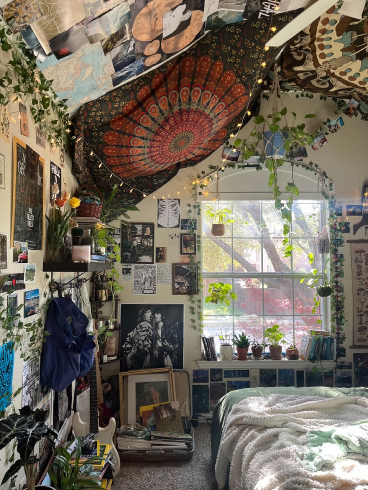 a dog laying on top of a bed in a room filled with pictures and plants