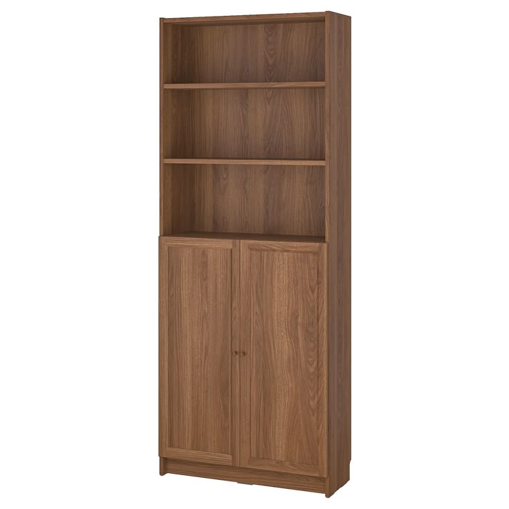 a wooden bookcase with three doors and two shelves