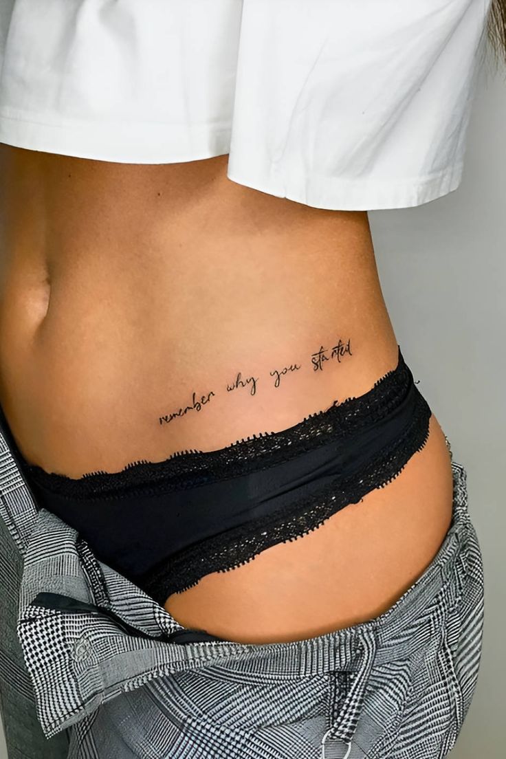 a woman's stomach with a tattoo that says, whatever is going on the other side