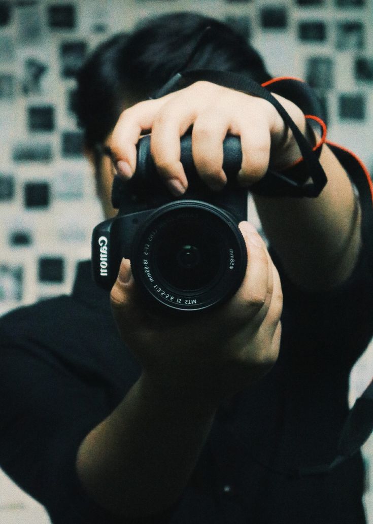 a person taking a photo with a camera