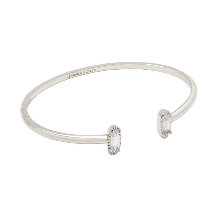 Looking for a pop of sparkle to add to your wrist stack? Meet the Emma Cuff Bracelet, aka your new style essential. Two elongated stones bookend this adjustable metal cuff you can fit to your wrist perfectly. On-trend and oh-so-cute, you'll style this bracelet time and time again. Designer, founder, and philanthropist Kendra Scott started her company in 2002, just three months after her first son was born. Her commitment to innovation, quality, customer service, and detail has taken her from a s Wrist Stack, College Closet, Statement Cuff Bracelet, Kendra Scott Bracelet, Wrist Stacks, Target Gifts, Brass Cuff Bracelet, Simple Bangle, Brass Cuff