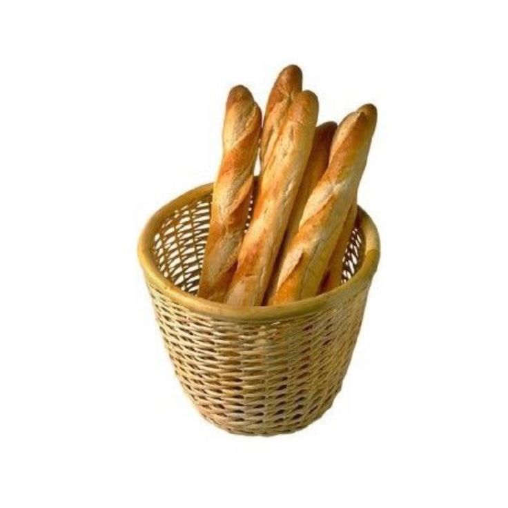 a basket filled with bread on top of a white table next to an advertisement for ba - guette