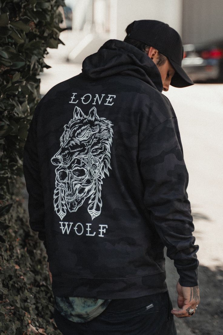 The mythology of the lone wolf stands the test of time. More legend than myth at all, the lone wolf breaks from the pack—by force or possibly necessity—and makes their own way. Territory becomes kingdom for this outsider, and their face instills fear but also reverence. This black camo hoodie reminds you: Alone doesn't mean lonely. Identify your kind with the shameless proclamation: I am a lone wolf. • UNISEX item• Cotton/polyester blend fleece• Ring spun cotton• 55% cotton/45% polyester• Unline Relentless Betrayal, Wolf Black, The Lone Wolf, Camo Hoodie, Mens Fashion Casual Outfits, Lone Wolf, Black Wolf, Black Camo, Cool Hoodies