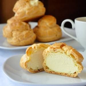 two plates with pastries on them and a cup of coffee