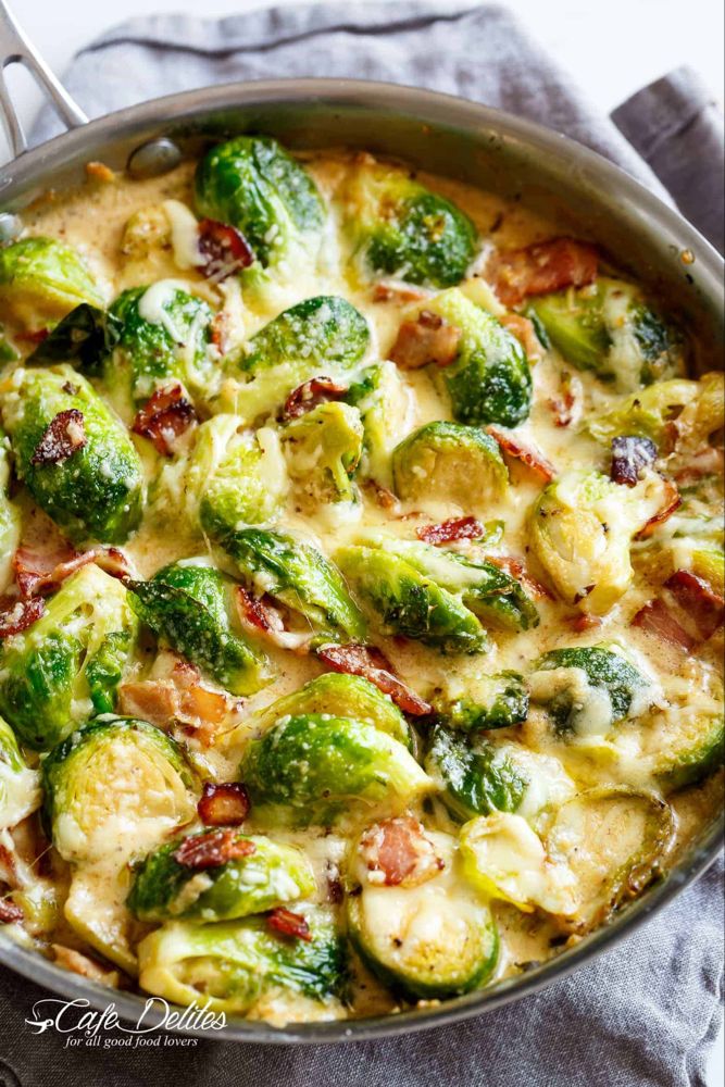 brussel sprouts with bacon and cheese in a skillet on a towel