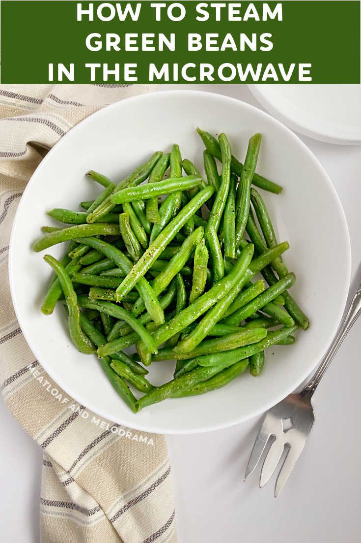 green beans in a white bowl with the title how to steam green beans in the microwave