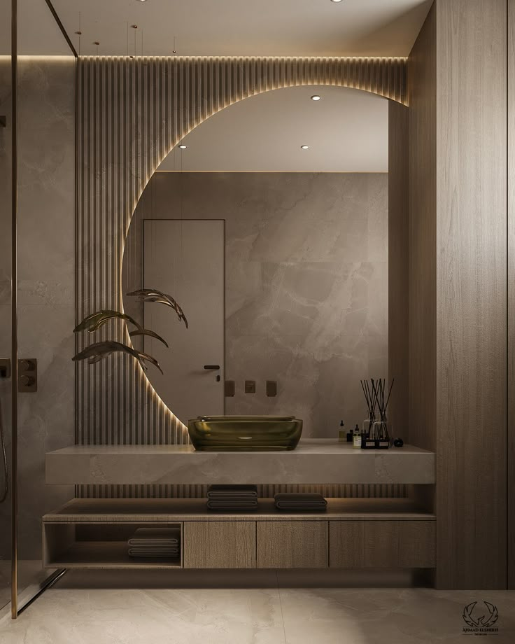 a bathroom with a large mirror, sink and plants on the counter top in front of it