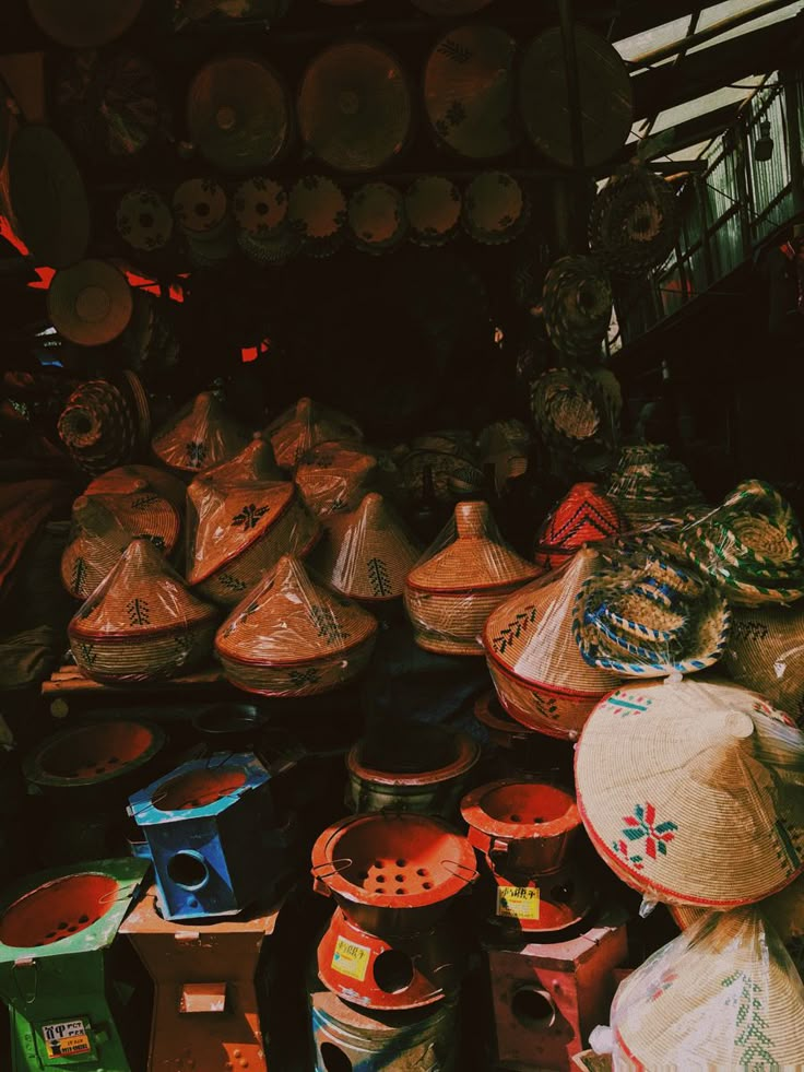 baskets and hats for sale at an outdoor market