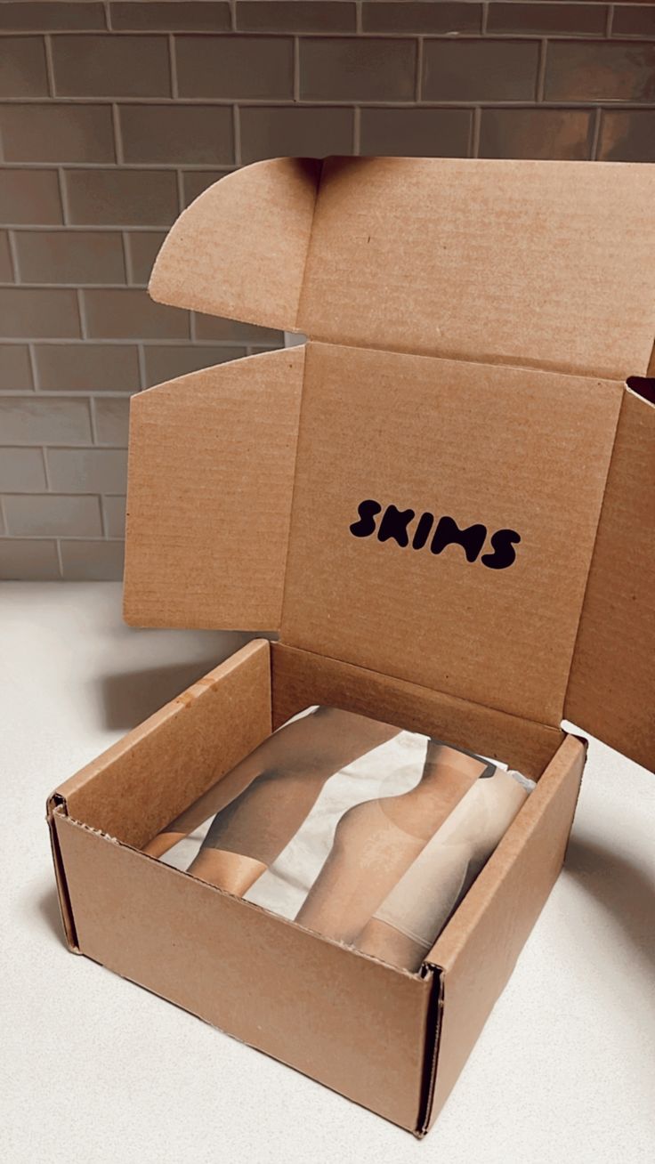 an open cardboard box sitting on top of a counter