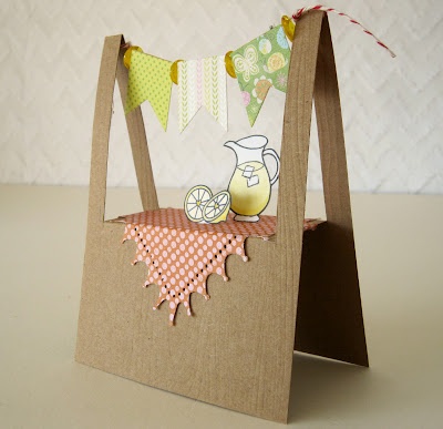 this is an image of a card made out of paper and cardboard with a bag on it