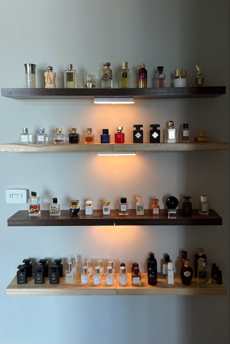 several shelves with different types of perfumes on them