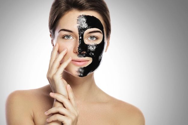 Woman with deep cleansing black mask on ... | Premium Photo #Freepik #photo #charcoal-mask #cosmetic-mask #facial-mask #skin-mask Carbon Laser Facial, Carbon Peel, Carbon Laser, Skin Care Diy, T Zone, Laser Peel, Laser Facial, Vampire Facial, Skin Mask