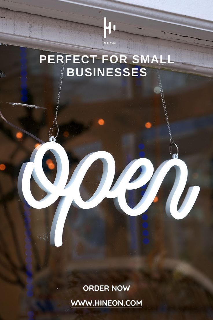 an open sign hanging in the window of a restaurant with lights behind it that says, perfect for small businesses