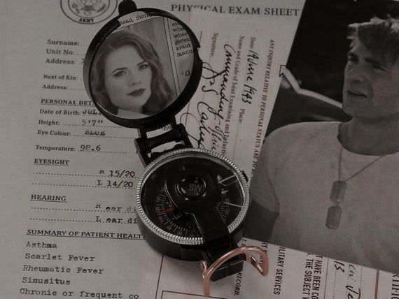 a close up of a person's watch on top of a piece of paper