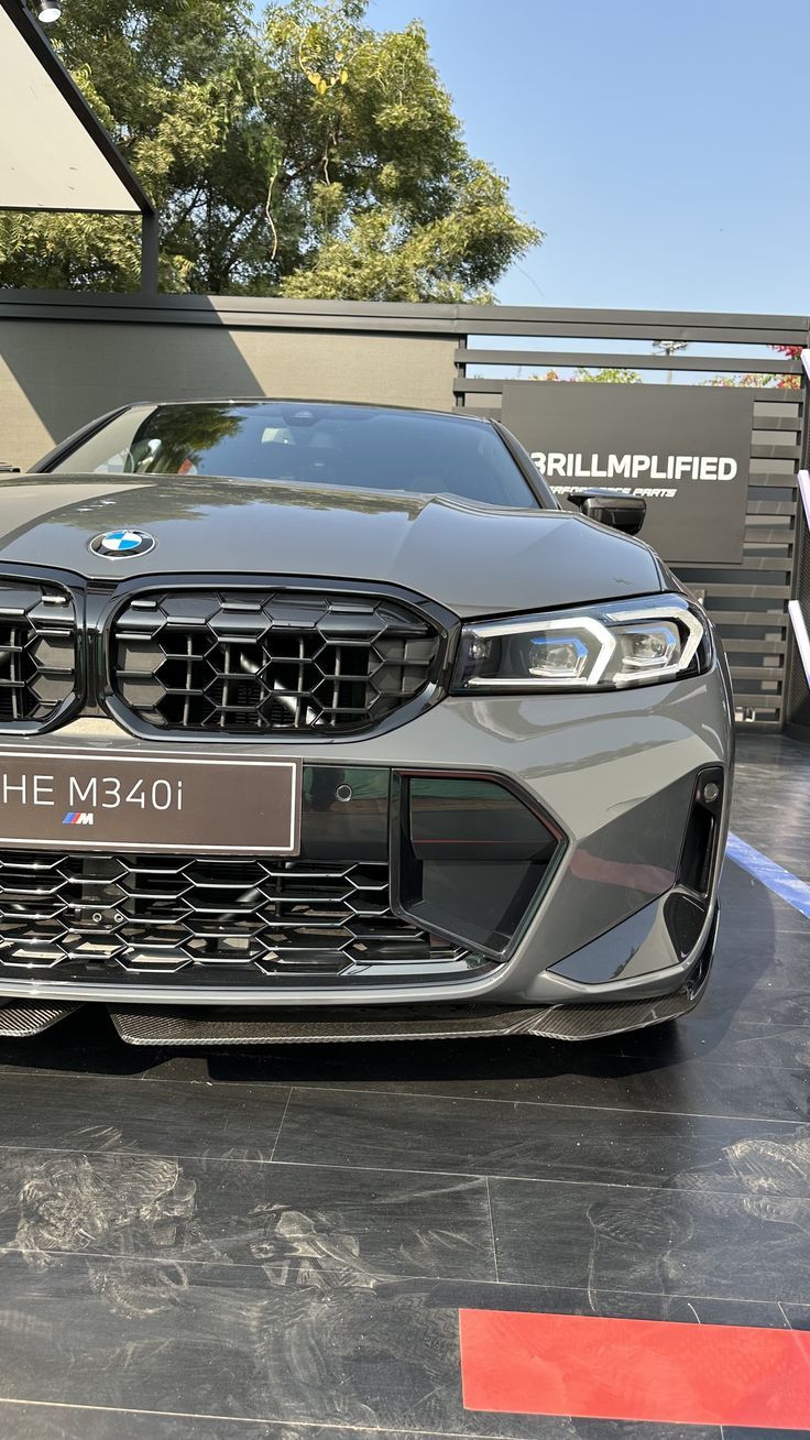 the front end of a grey bmw m840i