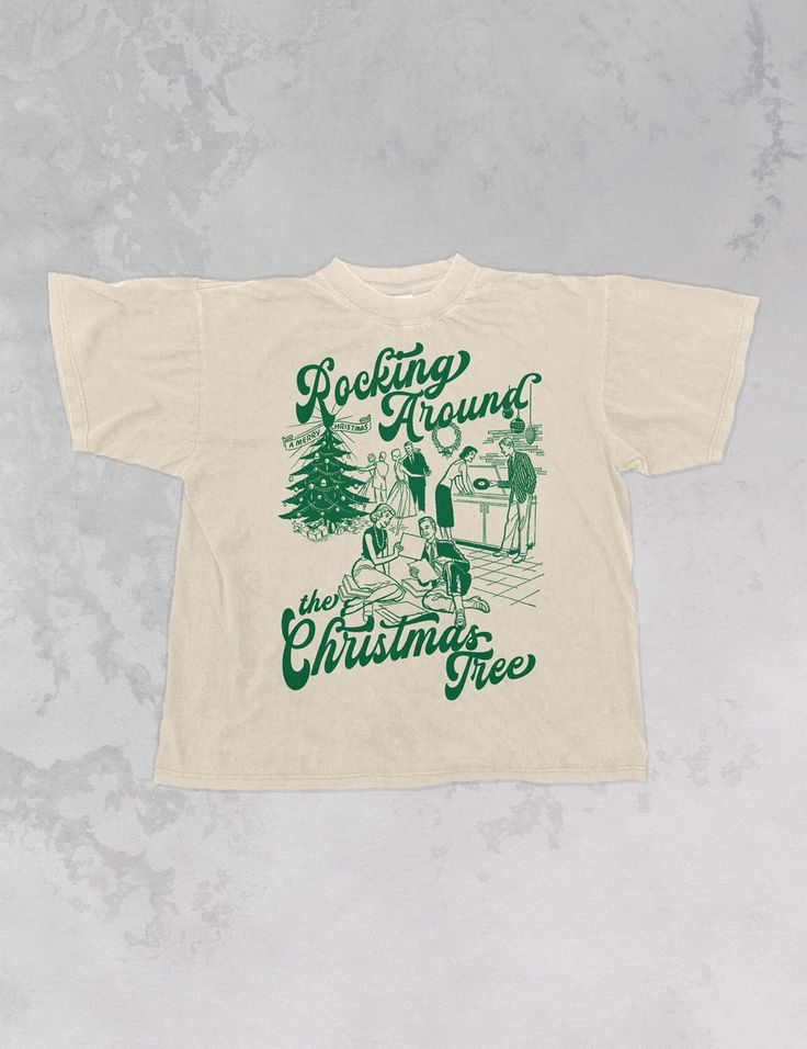 Start Rocking Around the Christmas Tree in our super cozy oversized tshirt, just in time for the Holiday season!- Features a Christmas party with the phrase "Rocking Around the Christmas Tree" around it all in a deep green ink- Screen print transfer that is individually heat pressed onto each tshirt- Printed on a vintage wash, super soft tshirt that gets softer with each wash- 100% Cotton- Oversized fit- Sizing translation: XS/S - L , S/M - XL , L/XL - 2XL , 2XL/3XL - 3XL**due to screens & filters color may vary from pictures** Cool Christmas Shirts, Retro Christmas Tshirt, Vintage Christmas Shirts, Sorority Christmas Shirts, Tshirt Trends 2024, Cricut Christmas Shirts, Christmas T Shirt Ideas, Christmas Tshirt Ideas, Crew Shirt Design