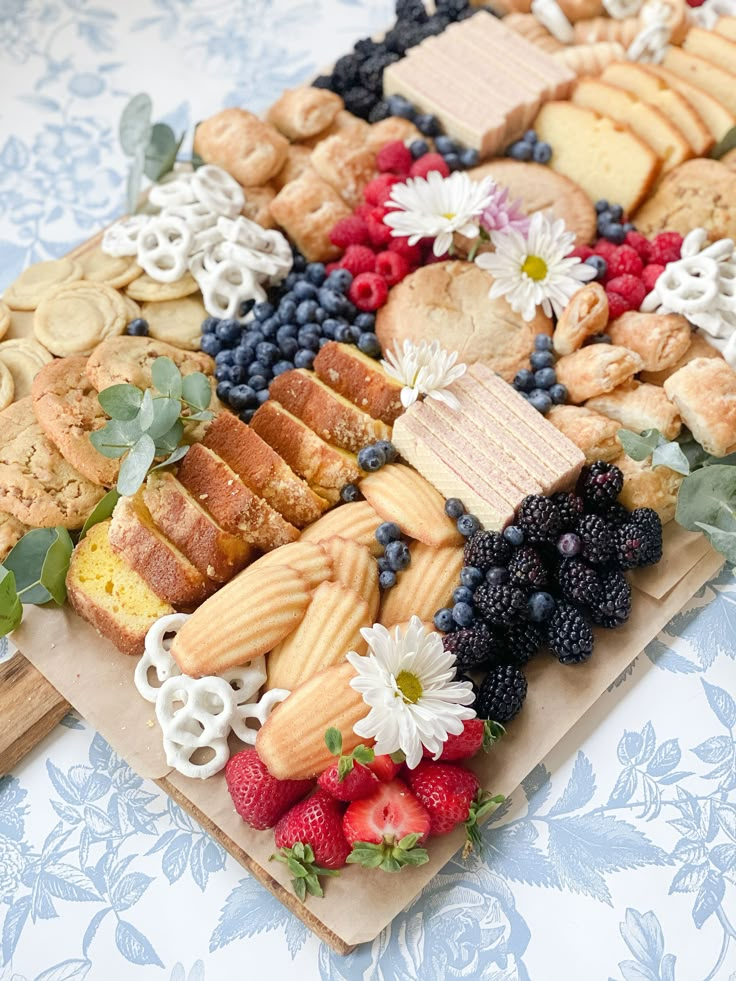 a platter filled with lots of different types of food on top of a table