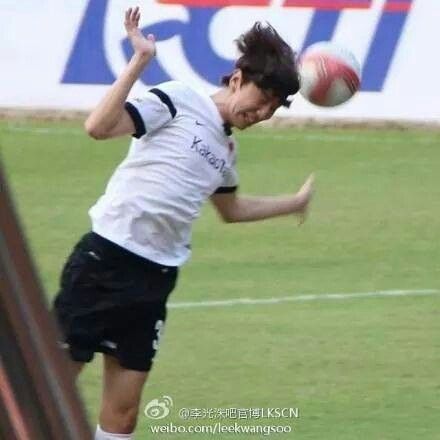 a person jumping up in the air to catch a soccer ball