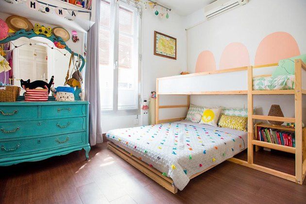 a child's bedroom with a bunk bed and dresser