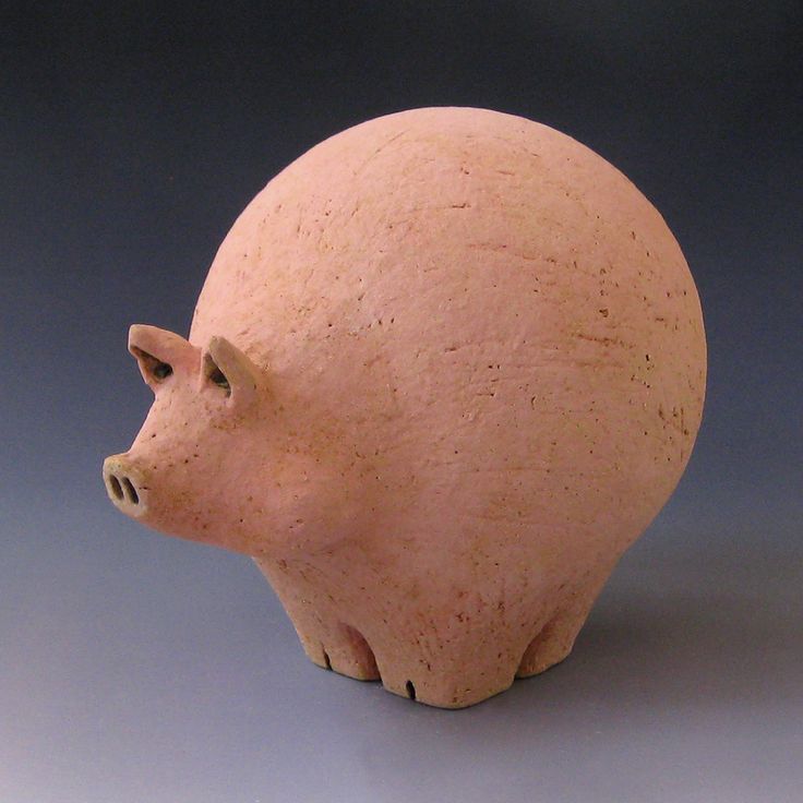 a ceramic pig head sitting on top of a table