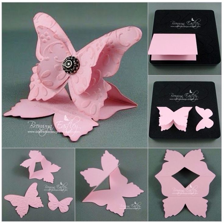 some pink paper butterflies are on display