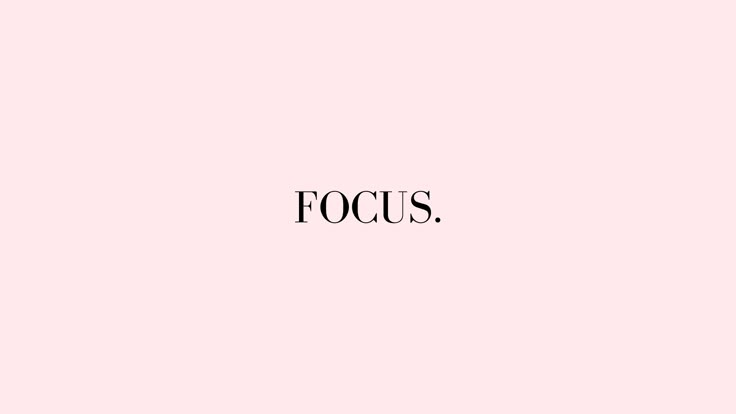 the word focus on a pink background