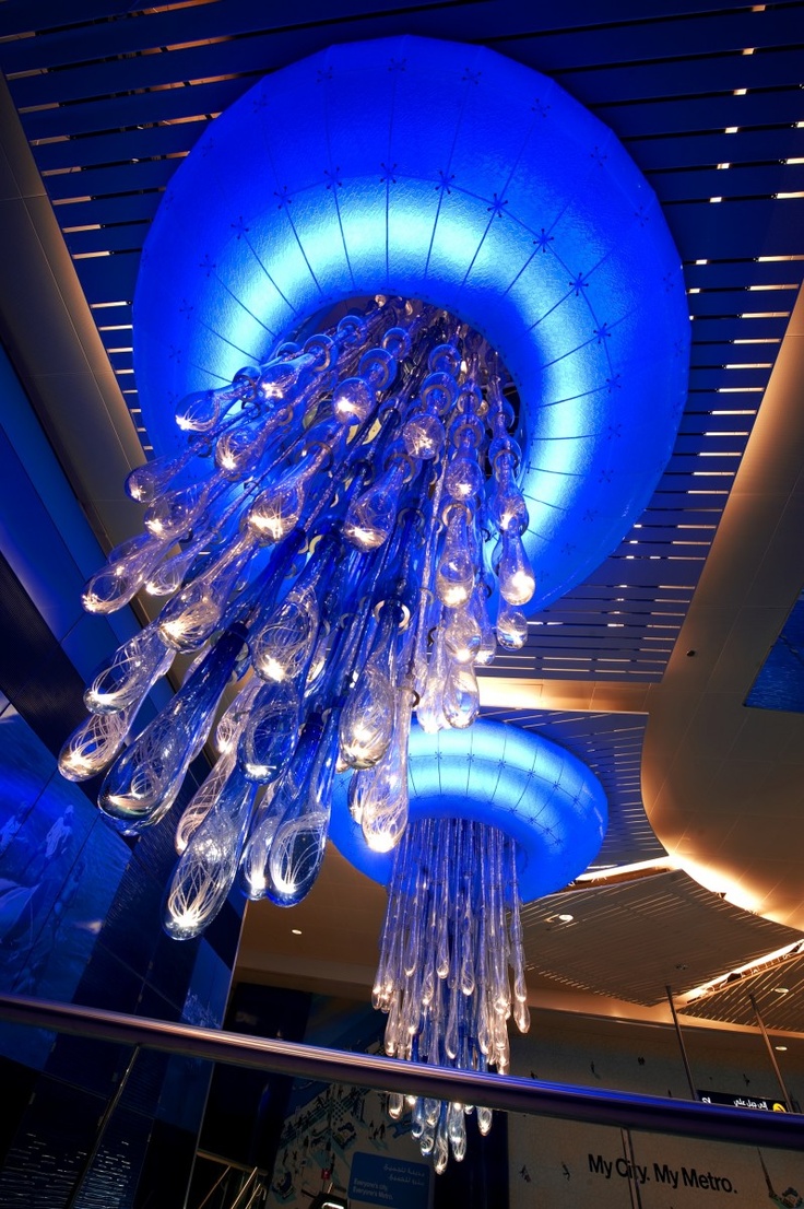 a large blue light hanging from the ceiling