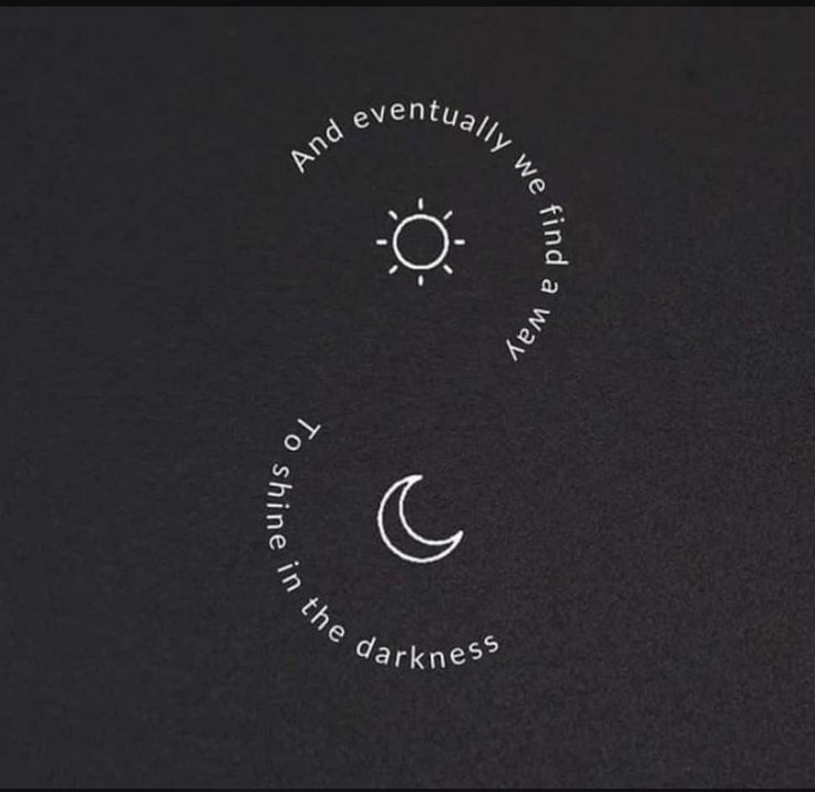 the back side of a black shirt with an image of a crescent and sun on it