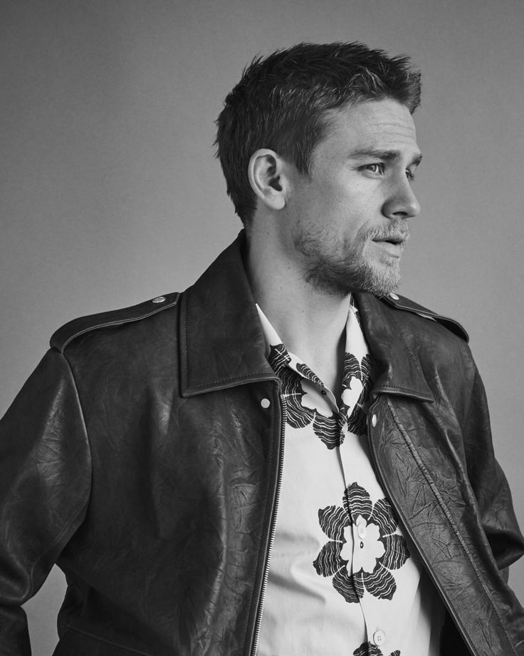 black and white photograph of a man wearing a leather jacket