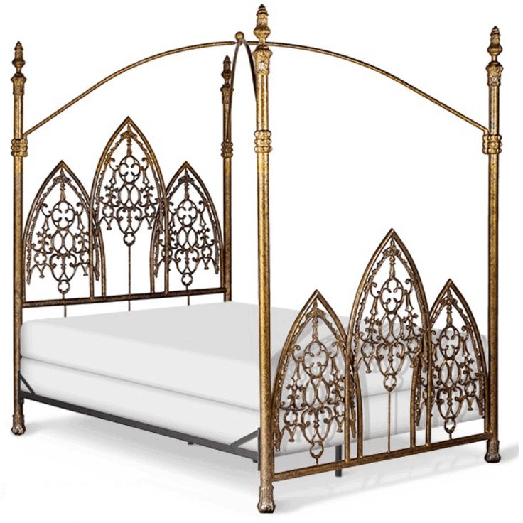 an ornate iron bed frame with white sheets