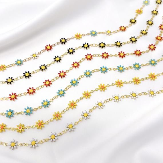 This listing is for a resizable gold plated enamel daisy chain choker made from brass, stainless steel, and gold plating. Choker is 14” with a 3.5” extension, maximum length is 17.5”. Great for layering! Available in white, yellow, blue, red, black, and multicolor. Cheap Adjustable Yellow Choker, Trendy Resizable Jewelry For Spring, Summer Choker With Clavicle Chain As Gift, Summer Clavicle Chain Choker As Gift, Gold Resizable Choker As Gift, Resizable Gold Choker As Gift, Spring Metal Jewelry With Adjustable Chain, Dainty Spring Jewelry With Adjustable Chain, Spring Dainty Jewelry With Adjustable Chain