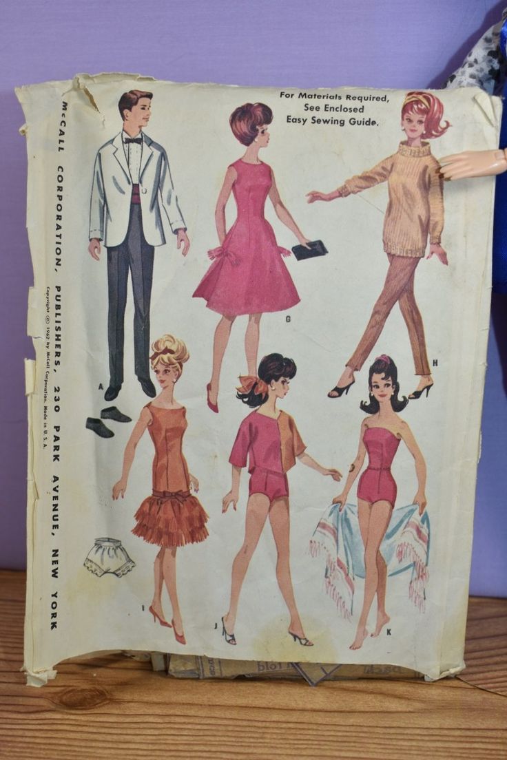 an old fashion paper doll with some clothes on it