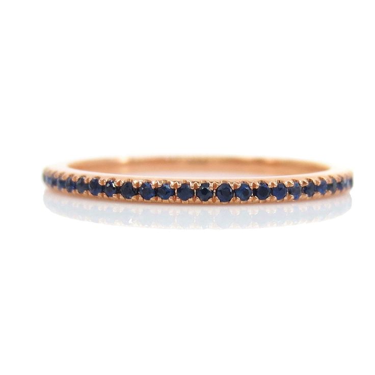 A gemstone eternity band is a perfect complement to any engagement ring or as stackable bands. DESCRIPTION: * Design: Full Eternity Band * Based on Ring Size: 6.5 * Metal: Solid 18K Yellow Gold * Gemstones: Genuine Sapphires * Color: Blue * Stone Count: 62 PCS * Weight: 0.22cts T.W * Band Width: 1.2mm (with +/- 0.1mm variation) Stone count & carat weight varies depending on the ring size. Beautiful Ring Box Included Elegant Sapphire Stackable Eternity Band, Fine Jewelry Sapphire Eternity Band, Sapphire Eternity Band With Vvs Clarity, Round Sapphire Eternity Band With Vvs Clarity, Elegant Sapphire Eternity Band With Prong Setting, Luxury Stackable Round Eternity Band, Stackable Yellow Gold Sapphire Eternity Band, Stackable Sapphire Eternity Band In Yellow Gold, Yellow Gold Sapphire Stackable Eternity Band