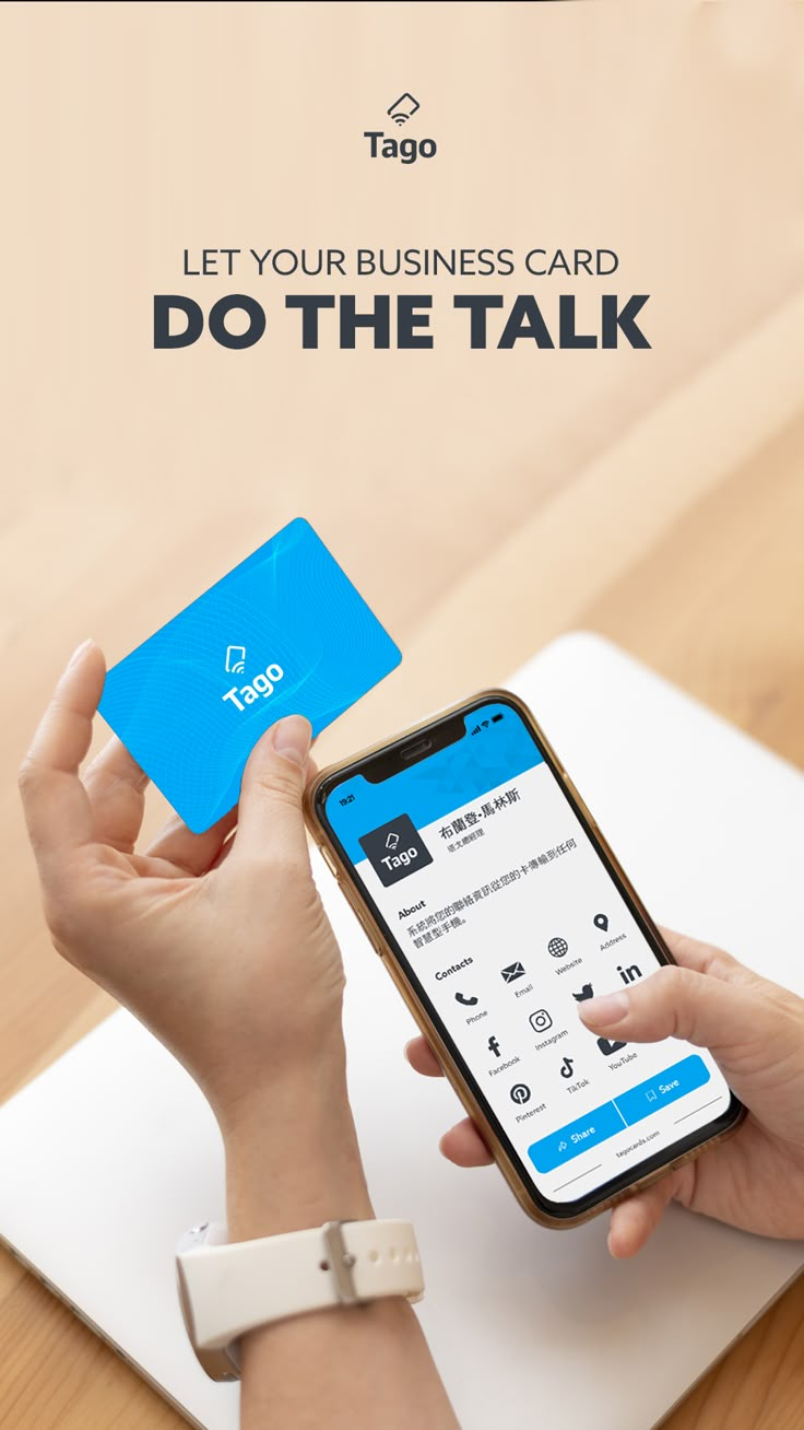 a person holding a cell phone and using a business card to do the talk on their laptop