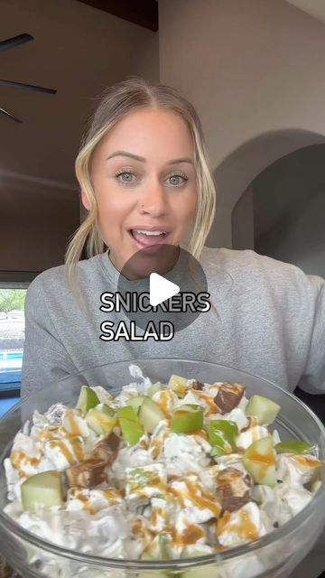 a woman holding a large bowl of food in front of her face with the caption saying, singer salad