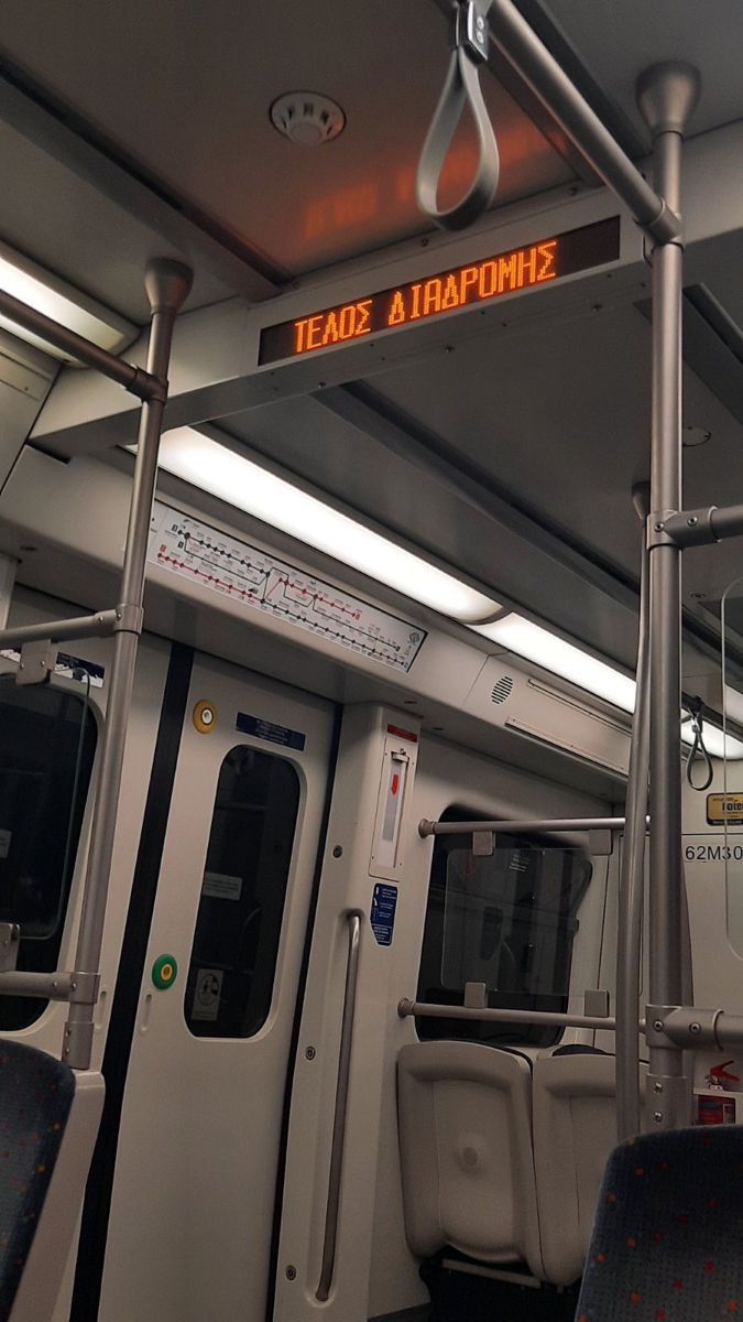 an empty train car with the lights on