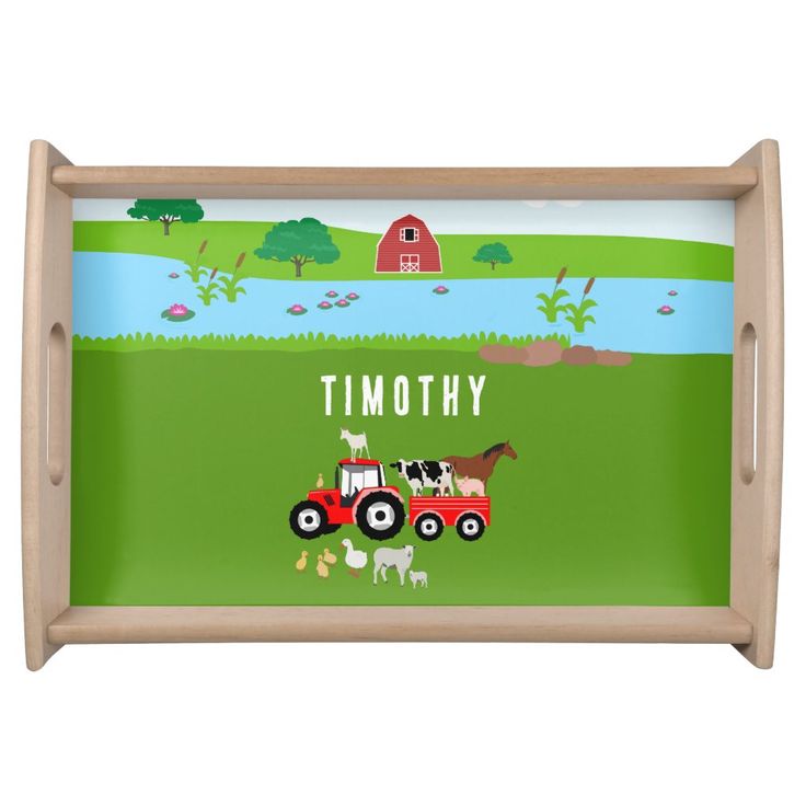 a wooden tray with a farm scene painted on the front and bottom, along with an illustration of a tractor