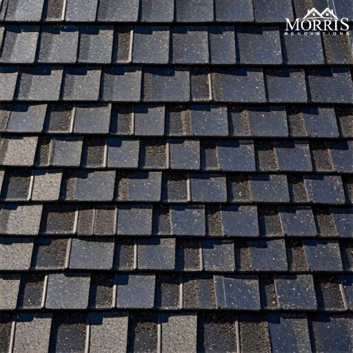 an image of a roof that looks like it is made out of black bricks and has no shingles