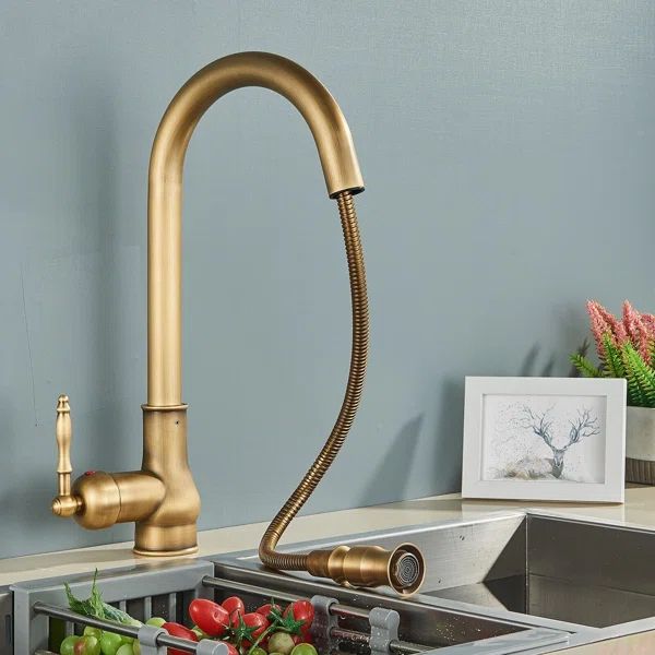 a faucet that is on the side of a sink in a room with blue walls