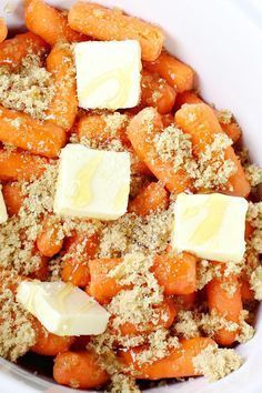 carrots and parmesan in a white bowl with butter on the top, ready to be eaten