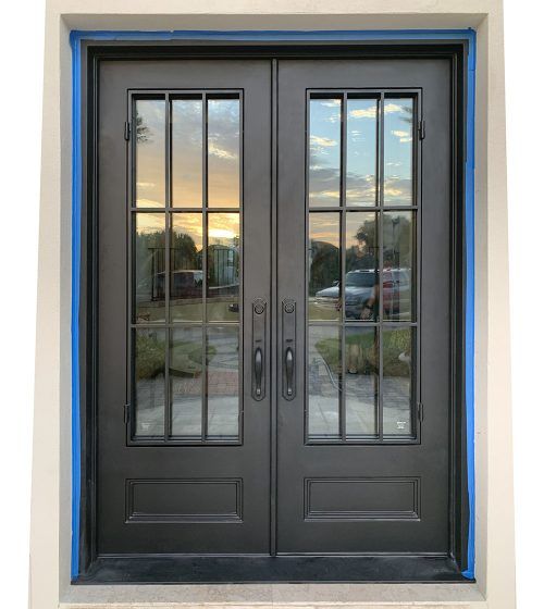 two double doors with blue trim and windows