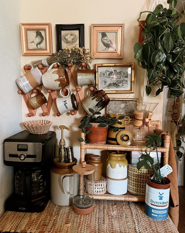 there is a shelf with pots and other items on it in the corner next to a potted plant