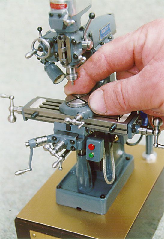 a person is working on a miniature machine