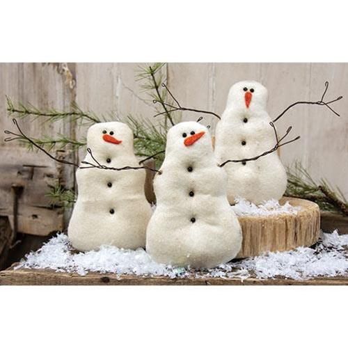 three snowmen sitting next to each other in front of a tree stump with the words set of three on it