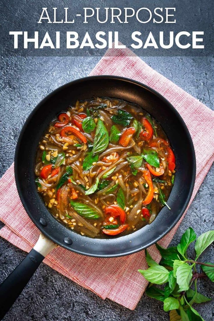 thai vegetable soup in a skillet on top of a red napkin and green leaves